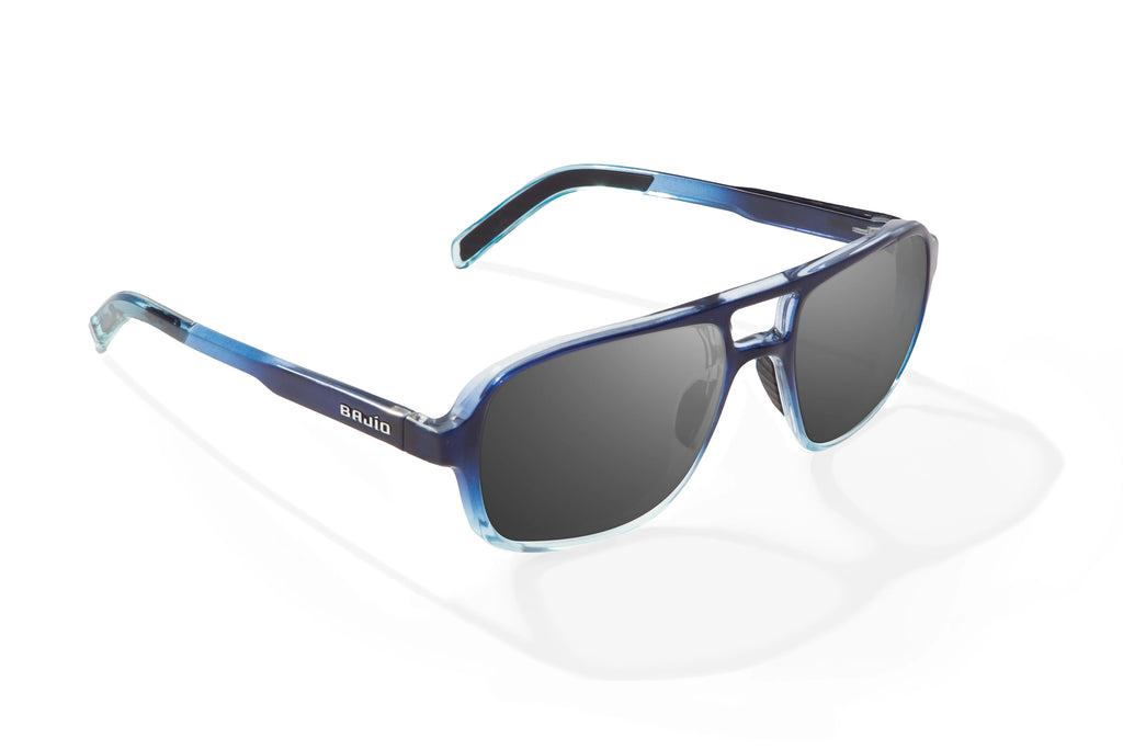 Angled view of Blue Sky Gloss 12 South Bajio beach sunglasses, bio-based nylon frames with gray polarized lenses, large-fit premium, built in sun ledge and sturdy barrel hinges, ideal for fishing and outdoor use.