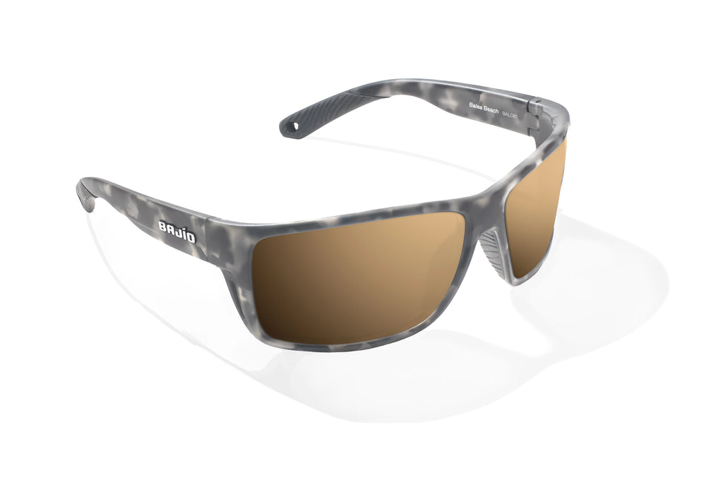 Angled view of Gray Rock Matte Bales Beach Bajio tech angler sunglasses, bio-based nylon frames with copper polarized lenses, full wrap, large fit, premium built in sun ledge and pin hinges, ideal for fishing and outdoor use.