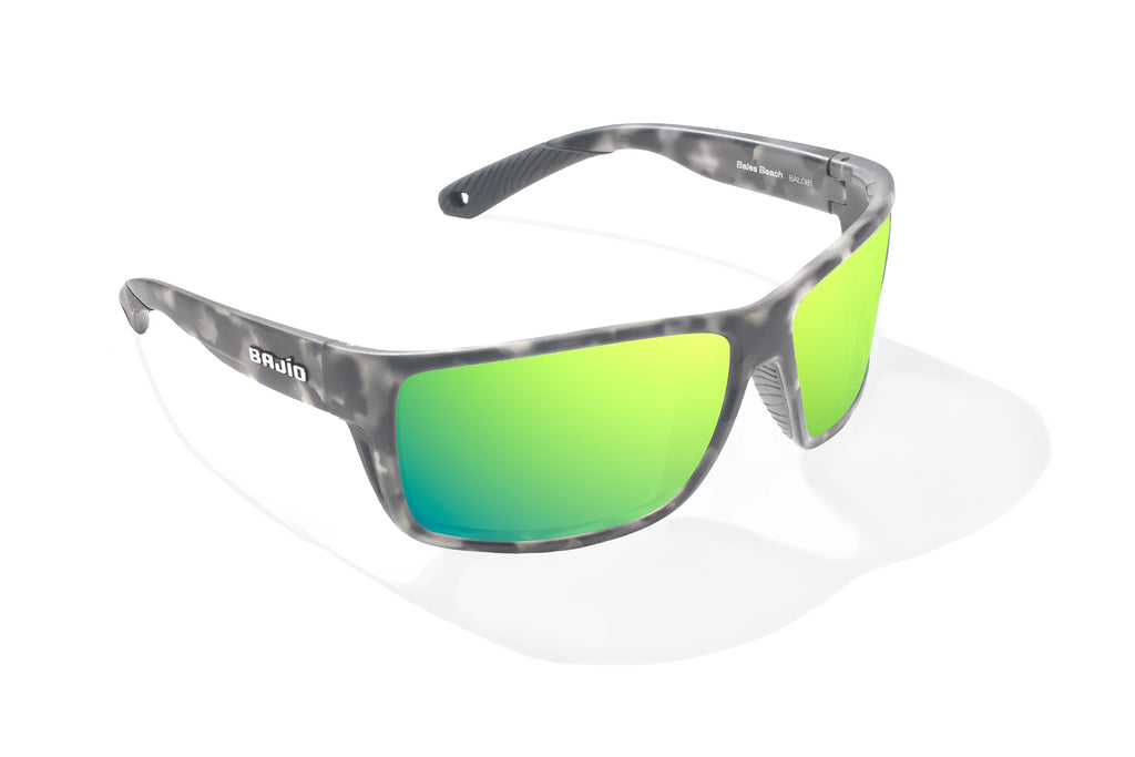 Angled view of Gray Rock Matte Bales Beach Bajio tech angler sunglasses, bio-based nylon frames with green mirror polarized lenses, full wrap, large fit, premium built in sun ledge and pin hinges, ideal for fishing and outdoor use.