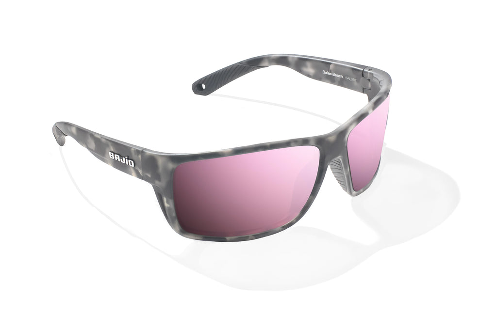 Angled view of Gray Rock Matte Bales Beach Bajio tech angler sunglasses, bio-based nylon frames with rose mirror polarized lenses, full wrap, large fit, premium built in sun ledge and pin hinges, ideal for fishing and outdoor use.