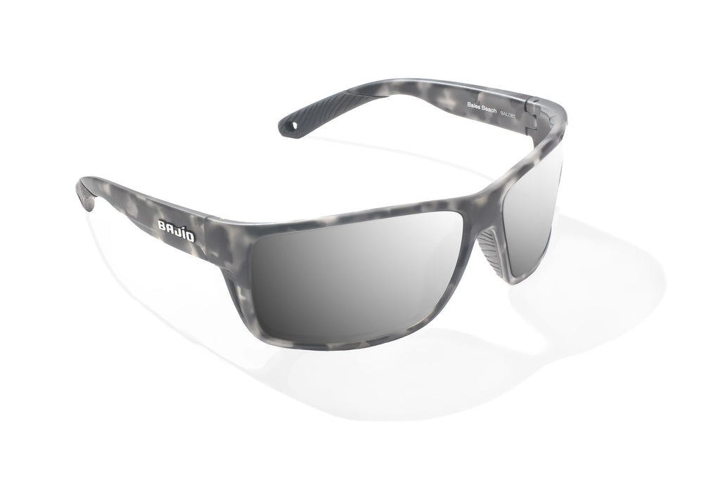 Angled view of Gray Rock Matte Bales Beach Bajio tech angler sunglasses, bio-based nylon frames with silver mirror polarized lenses, full wrap, large fit, premium built in sun ledge and pin hinges, ideal for fishing and outdoor use.