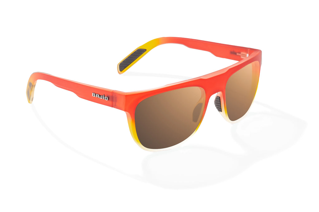 Angled view of Red Yellow Sky Matte Chelem Bajio surf sunglasses, bio-based nylon frames with copper polarized lenses, medium wrap, medium fit, premium built in sun ledge and flex hinges, ideal for fishing and outdoor use.