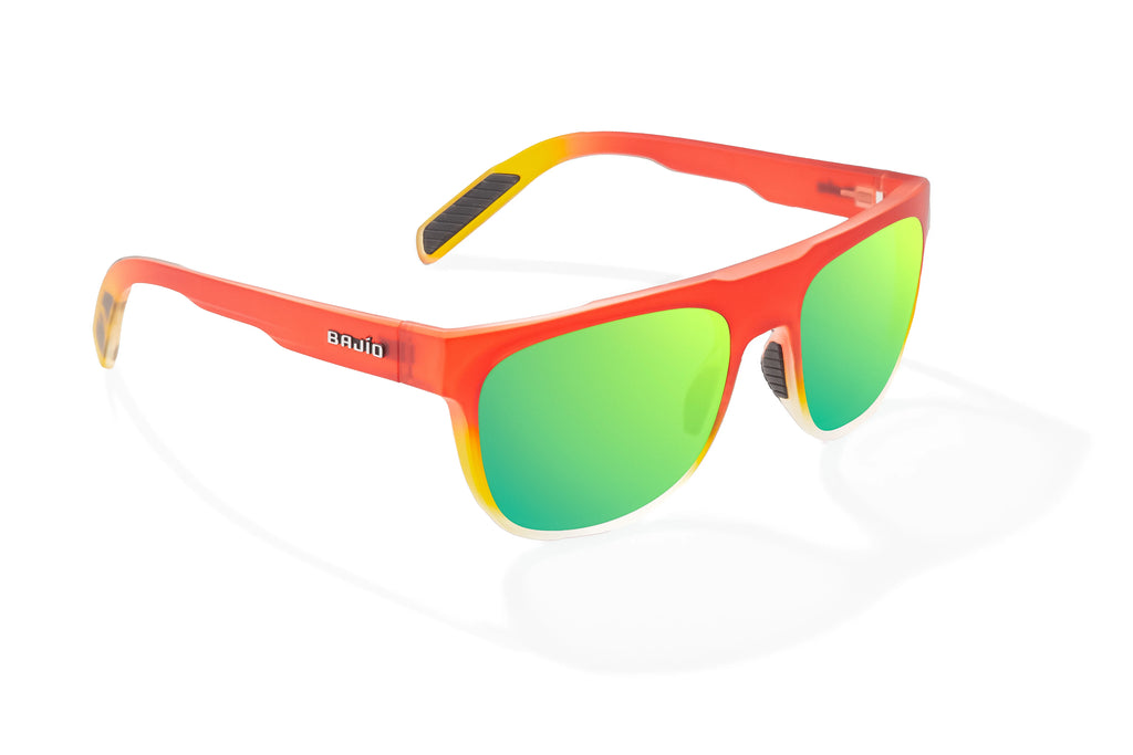 Angled view of Red Yellow Sky Matte Chelem Bajio surf sunglasses, bio-based nylon frames with green mirror polarized lenses, medium wrap, medium fit, premium built in sun ledge and flex hinges, ideal for fishing and outdoor use.