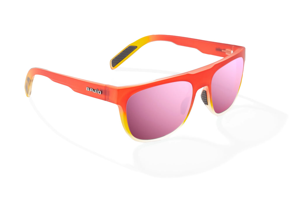 Angled view of Red Yellow Sky Matte Chelem Bajio surf sunglasses, bio-based nylon frames with rose mirror polarized lenses, medium wrap, medium fit, premium built in sun ledge and flex hinges, ideal for fishing and outdoor use.