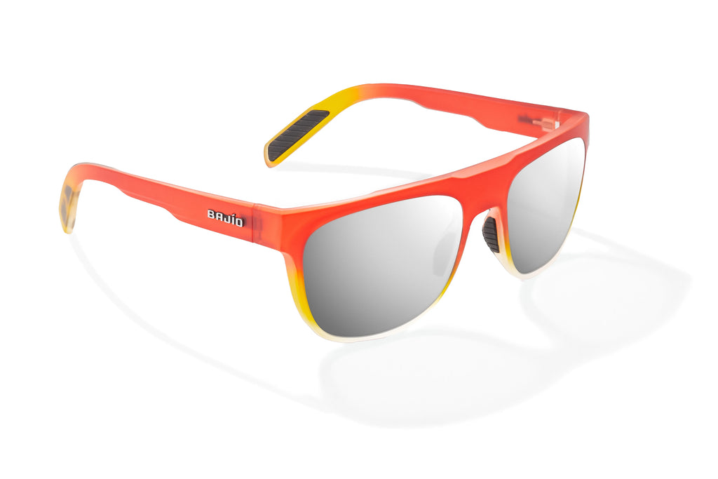 Angled view of Red Yellow Sky Matte Chelem Bajio surf sunglasses, bio-based nylon frames with silver mirror polarized lenses, medium wrap, medium fit, premium built in sun ledge and flex hinges, ideal for fishing and outdoor use.