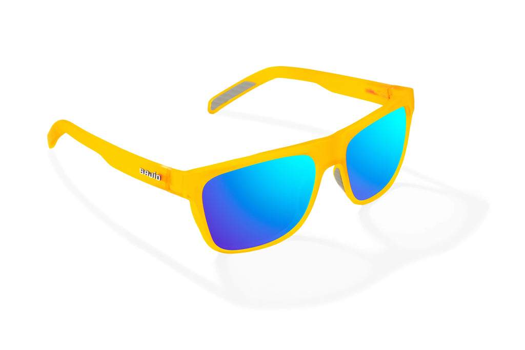 Angled view of Yellow Glass Matte Hopedale Bajio surf sunglasses, bio-based nylon frames with blue mirror polarized lenses, medium wrap, large fit, premium built in sun ledge and flex hinges, ideal for fishing and outdoor use.