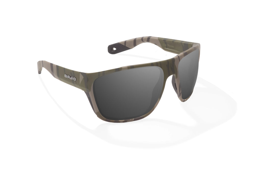 Angled view of Army Green Bottomlands Las Rocas in collaboration with Mossy Oak x Bajio tech angler sunglasses, bio-based nylon frames with gray polarized lenses, full wrap, extra large fit premium, built in sun ledge and flex hinges, ideal for fishing and outdoor use.