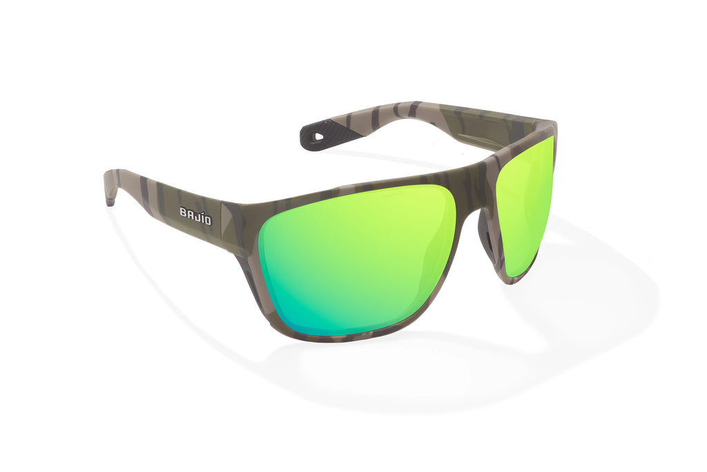 Angled view of Army Green Bottomlands Las Rocas in collaboration with Mossy Oak x Bajio tech angler sunglasses, bio-based nylon frames with green mirror polarized lenses, full wrap, extra large fit premium, built in sun ledge and flex hinges, ideal for fishing and outdoor use.