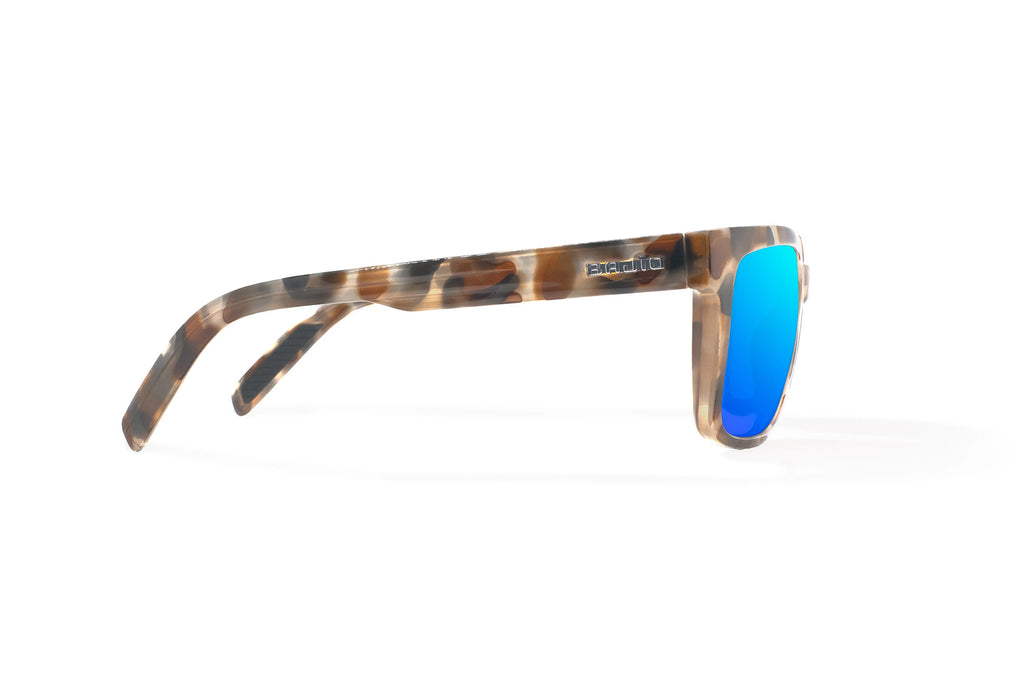 Side view of Tan Rock Gloss Paila Bajio beach sunglasses, bio-based nylon frames with blue mirror polarized lenses, extra large fit premium, built in sun ledge and sturdy barrel hinges, ideal for fishing and outdoor use.