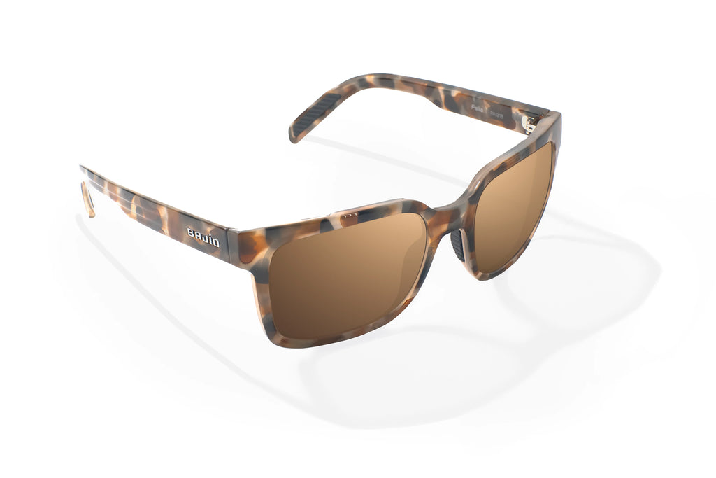 Angled view of Tan Rock Gloss Paila Bajio beach sunglasses, bio-based nylon frames with copper polarized lenses, extra large fit premium, built in sun ledge and sturdy barrel hinges, ideal for fishing and outdoor use.