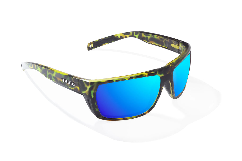 Angled view of Green Rock Gloss Palometa Bajio tech angler sunglasses, bio-based nylon frames with blue mirror polarized lenses, full wrap, medium fit, premium built in sun ledge and flex hinges, ideal for fishing and outdoor use.