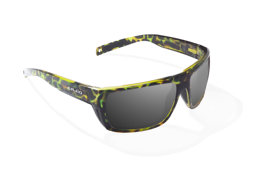 Angled view of Green Rock Gloss Palometa Bajio tech angler sunglasses, bio-based nylon frames with gray polarized lenses, full wrap, medium fit, premium built in sun ledge and flex hinges, ideal for fishing and outdoor use.