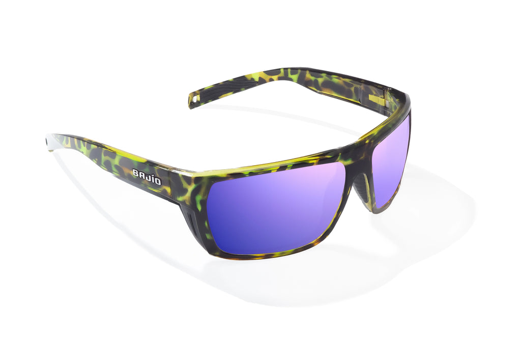 Angled view of Green Rock Gloss Palometa Bajio tech angler sunglasses, bio-based nylon frames with violet mirror polarized lenses, full wrap, medium fit, premium built in sun ledge and flex hinges, ideal for fishing and outdoor use.