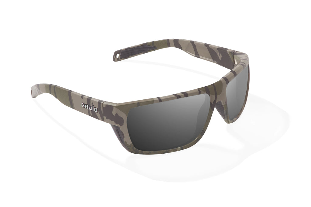 Angled view of Army Green Bottomlands Palometa in collaboration with Mossy Oak x Bajio tech angler sunglasses, bio-based nylon frames with gray polarized lenses, full wrap, medium fit, premium built in sun ledge and flex hinges, ideal for fishing and outdoor use.