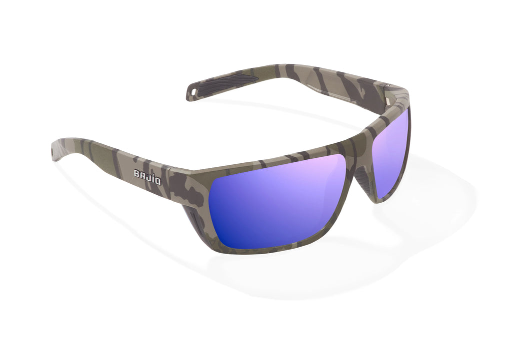 Angled view of Army Green Bottomlands Palometa in collaboration with Mossy Oak x Bajio tech angler sunglasses, bio-based nylon frames with violet mirror polarized lenses, full wrap, medium fit, premium built in sun ledge and flex hinges, ideal for fishing and outdoor use.