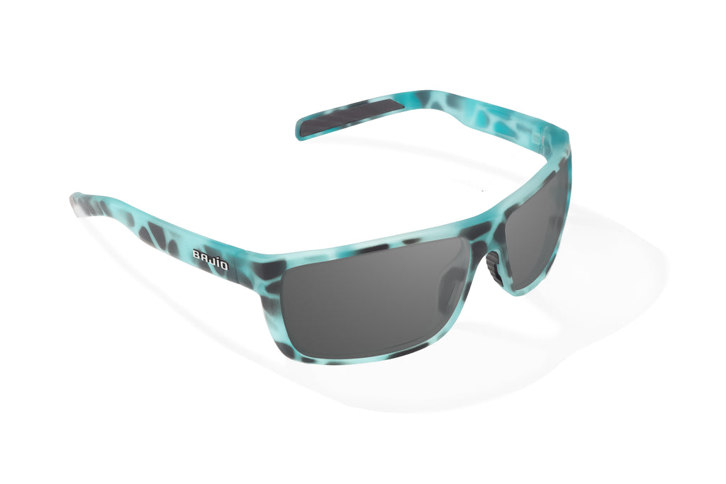 Angled view of Light Blue Water Matte Sigs Bajio tight line sunglasses, bio-based nylon frames with gray polarized lenses, full wrap, medium fit, premium built in sun ledge and flex hinges, ideal for fishing and outdoor use.