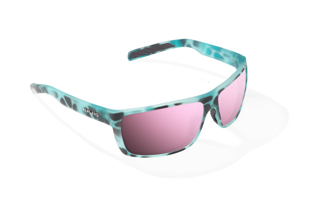 Angled view of Light Blue Water Matte Sigs Bajio tight line sunglasses, bio-based nylon frames with rose mirror polarized lenses, full wrap, medium fit, premium built in sun ledge and flex hinges, ideal for fishing and outdoor use.