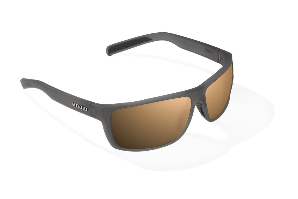 Angled view of Dark Gray Glass Matte Sigs Bajio tight line sunglasses, bio-based nylon frames with copper polarized lenses, full wrap, medium fit, premium built in sun ledge and flex hinges, ideal for fishing and outdoor use.