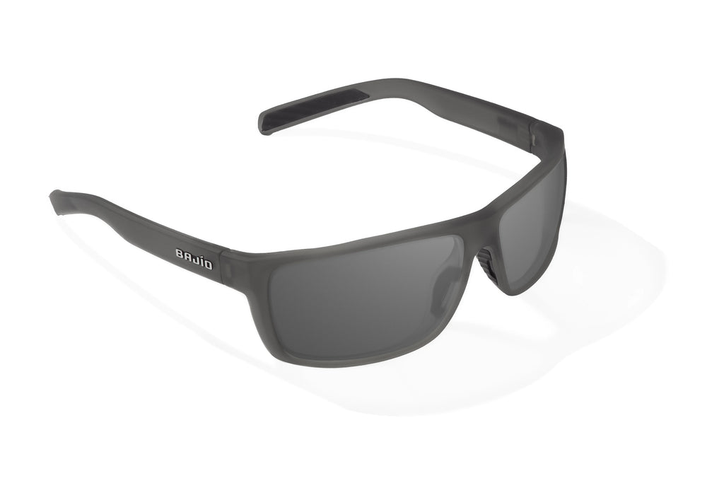 Angled view of Dark Gray Glass Matte Sigs Bajio tight line sunglasses, bio-based nylon frames with gray polarized lenses, full wrap, medium fit, premium built in sun ledge and flex hinges, ideal for fishing and outdoor use.