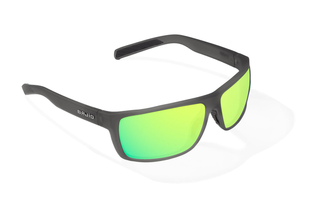 Angled view of Dark Gray Glass Matte Sigs Bajio tight line sunglasses, bio-based nylon frames with green mirror polarized lenses, full wrap, medium fit, premium built in sun ledge and flex hinges, ideal for fishing and outdoor use.