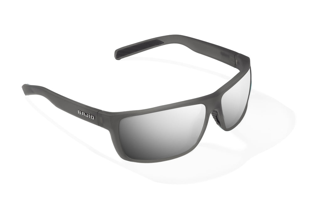 Angled view of Dark Gray Glass Matte Sigs Bajio tight line sunglasses, bio-based nylon frames with silver mirror polarized lenses, full wrap, medium fit, premium built in sun ledge and flex hinges, ideal for fishing and outdoor use.