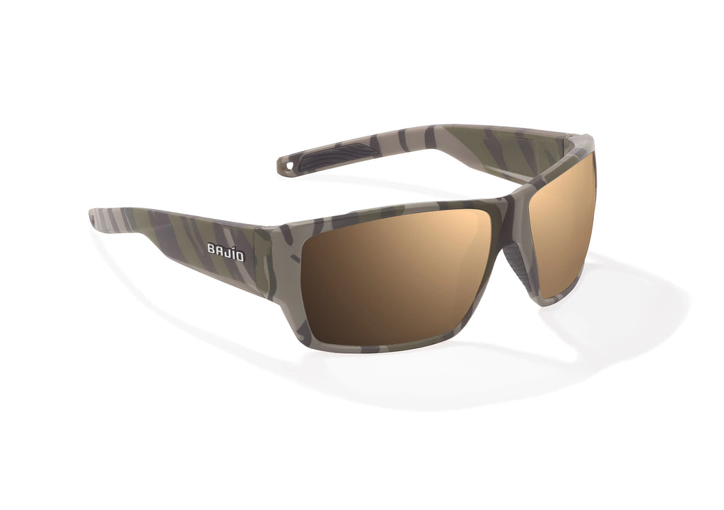 Angled view of Army Green Bottomlands Vega in collaboration with Mossy Oak x Bajio wide body sunglasses, bio-based nylon frames with copper polarized lenses, full wrap, large fit, premium built in sun ledge and flex hinges, ideal for fishing and outdoor use.
