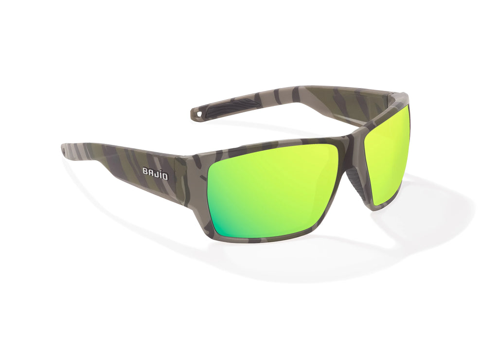 Angled view of Army Green Bottomlands Vega in collaboration with Mossy Oak x Bajio wide body sunglasses, bio-based nylon frames with green mirror polarized lenses, full wrap, large fit, premium built in sun ledge and flex hinges, ideal for fishing and outdoor use.