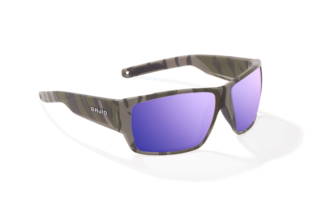 Angled view of Army Green Bottomlands Vega in collaboration with Mossy Oak x Bajio wide body sunglasses, bio-based nylon frames with violet mirror polarized lenses, full wrap, large fit, premium built in sun ledge and flex hinges, ideal for fishing and outdoor use.