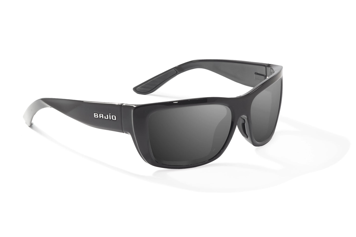 Angled view of Black Gloss Annette Bajio wide body sunglasses, bio-based nylon frames with gray polarized lenses, full wrap, small fit, premium built in sun ledge and flex hinges, ideal for fishing and outdoor use.