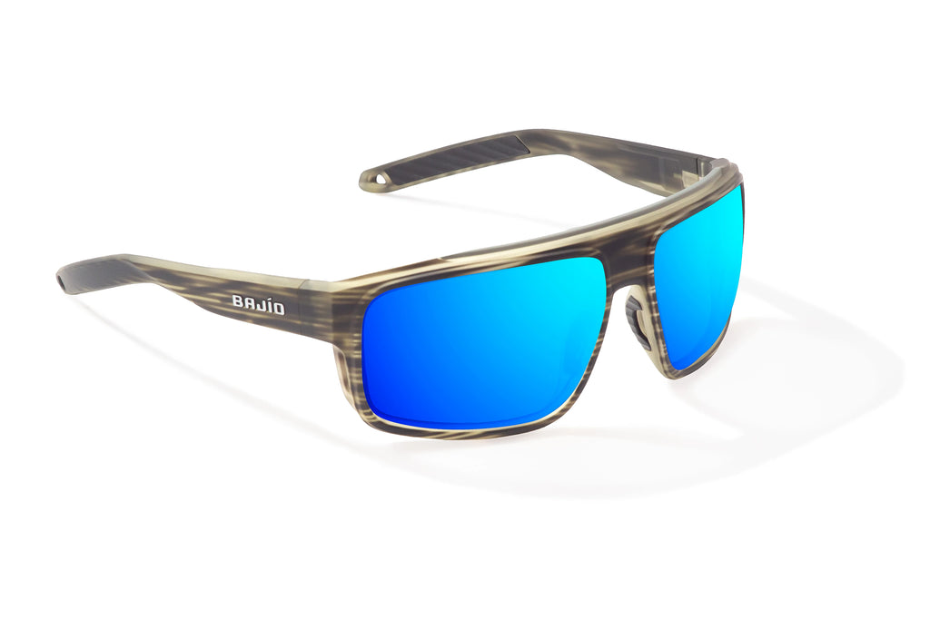 Angled view of Gray Grass Matte Greenland Bajio tech angler sunglasses, bio-based nylon frames with blue mirror polarized lenses, full wrap, large fit, premium built in sun ledge and flex hinges, ideal for fishing and outdoor use.