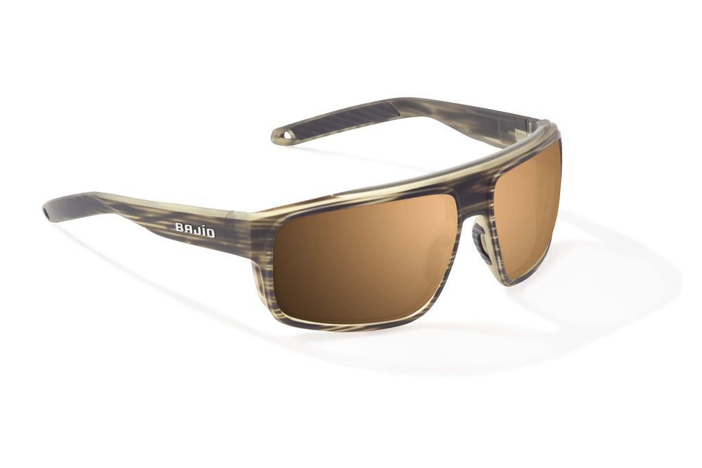 Angled view of Gray Grass Matte Greenland Bajio tech angler sunglasses, bio-based nylon frames with copper polarized lenses, full wrap, large fit, premium built in sun ledge and flex hinges, ideal for fishing and outdoor use.