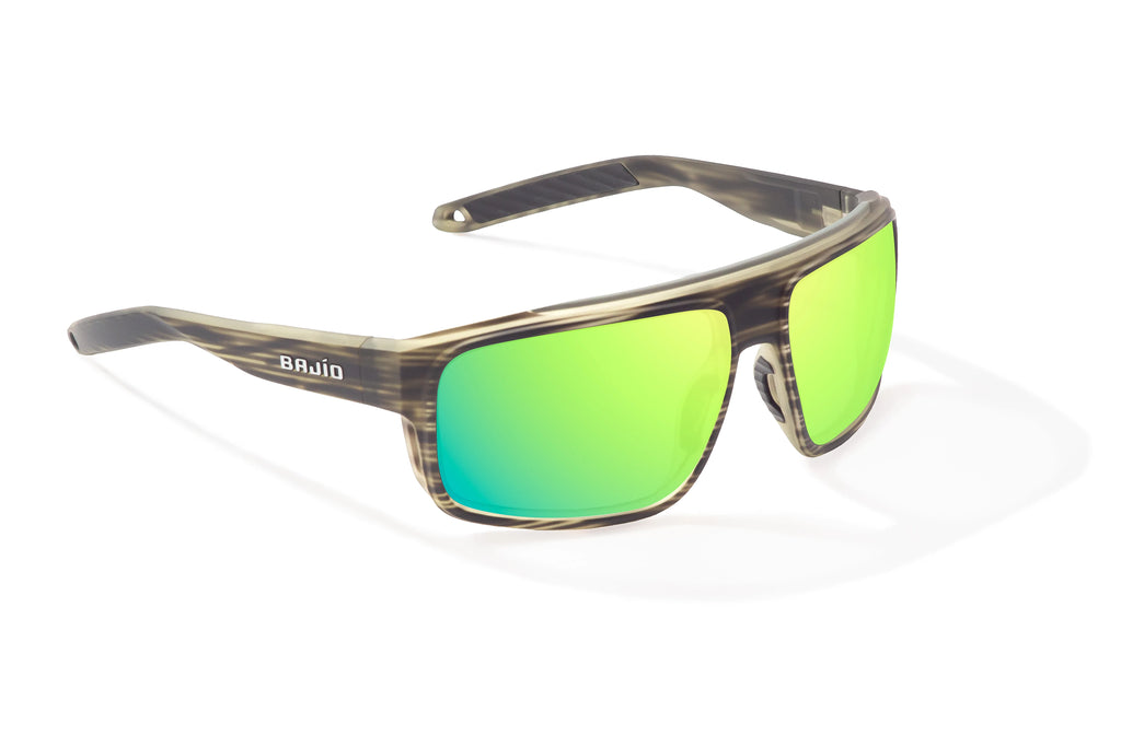 Angled view of Gray Grass Matte Greenland Bajio tech angler sunglasses, bio-based nylon frames with green mirror polarized lenses, full wrap, large fit, premium built in sun ledge and flex hinges, ideal for fishing and outdoor use.