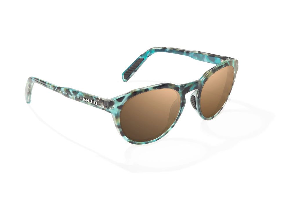 Angled view of Blue Rock Gloss Paraiso Bajio beach sunglasses, bio-based nylon frames with copper polarized lenses, medium wrap, small fit premium, built in sun ledge and sturdy barrel hinges, ideal for fishing and outdoor use.