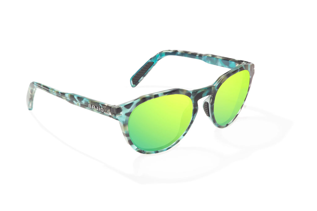 Angled view of Blue Rock Gloss Paraiso Bajio beach sunglasses, bio-based nylon frames with green mirror polarized lenses, medium wrap, small fit premium, built in sun ledge and sturdy barrel hinges, ideal for fishing and outdoor use.