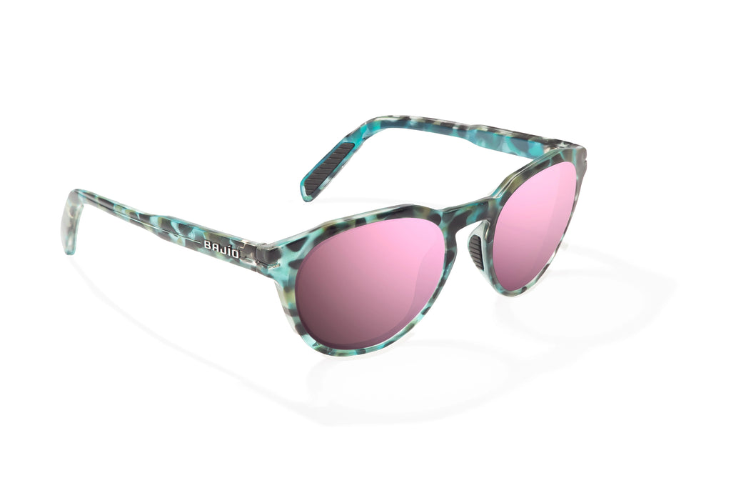 Angled view of Blue Rock Gloss Paraiso Bajio beach sunglasses, bio-based nylon frames with rose mirror polarized lenses, medium wrap, small fit premium, built in sun ledge and sturdy barrel hinges, ideal for fishing and outdoor use.