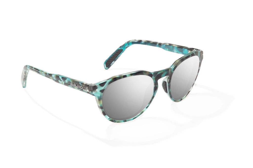 Angled view of Blue Rock Gloss Paraiso Bajio beach sunglasses, bio-based nylon frames with silver mirror polarized lenses, medium wrap, small fit premium, built in sun ledge and sturdy barrel hinges, ideal for fishing and outdoor use.