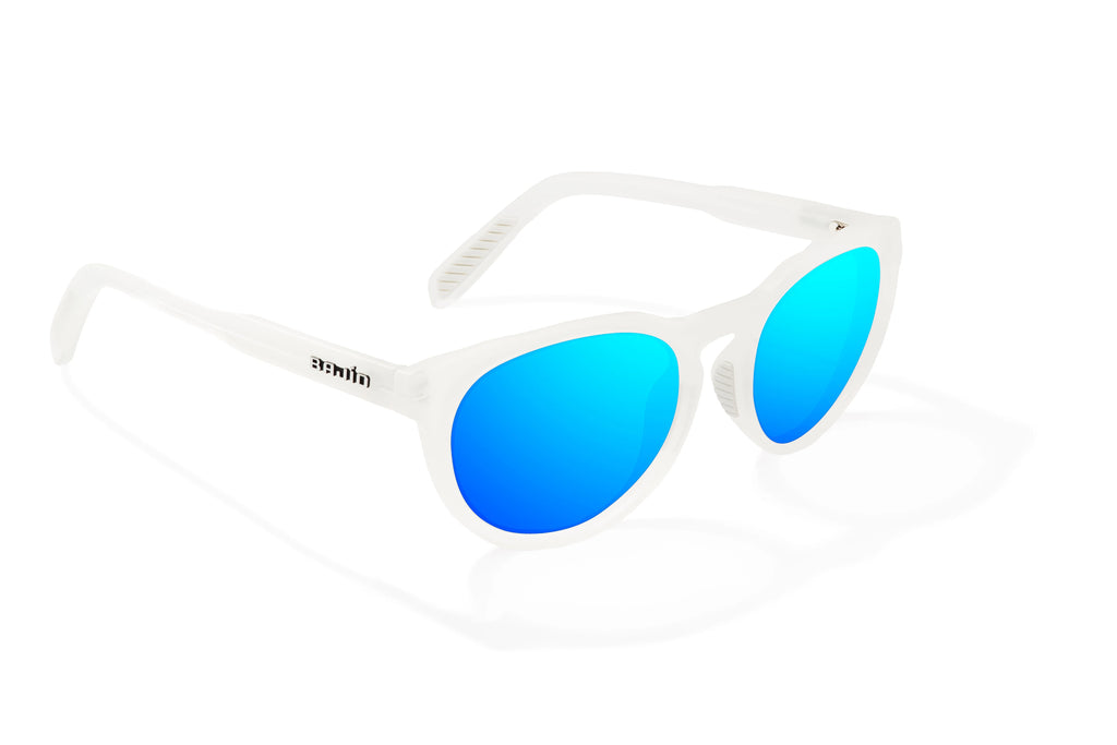 Angled view of White Glass Gloss Paraiso Bajio beach sunglasses, bio-based nylon frames with blue mirror polarized lenses, medium wrap, small fit premium, built in sun ledge and sturdy barrel hinges, ideal for fishing and outdoor use.