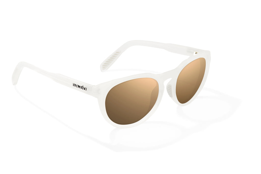 Angled view of White Glass Gloss Paraiso Bajio beach sunglasses, bio-based nylon frames with copper polarized lenses, medium wrap, small fit premium, built in sun ledge and sturdy barrel hinges, ideal for fishing and outdoor use.