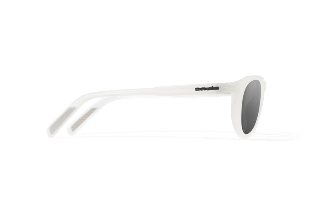 Side view of White Glass Gloss Paraiso Bajio beach sunglasses, bio-based nylon frames with gray polarized lenses, medium wrap, small fit premium, built in sun ledge and sturdy barrel hinges, ideal for fishing and outdoor use.